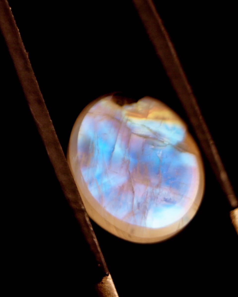 Moonstone resting on dark stone