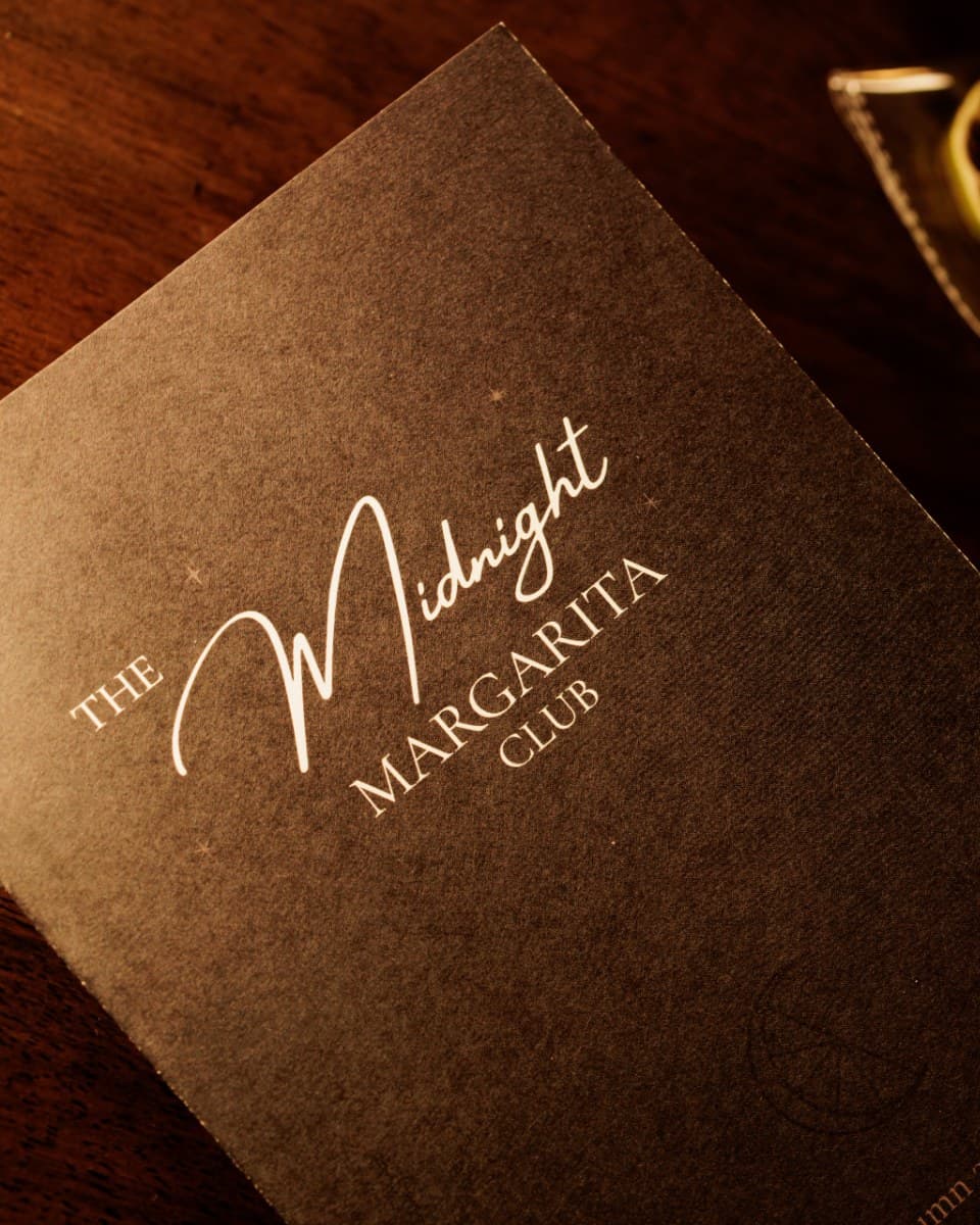 The Club Manual, a closed journal with a ribbon bookmark